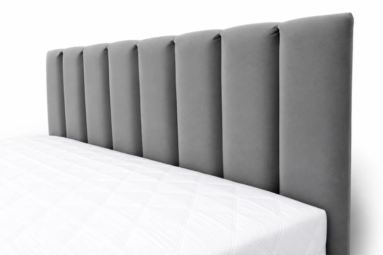 Łóżko tapicerowane z pojemnikiem na pościel 140x200 Karol - widok na detal zagłowia z przeszyciami